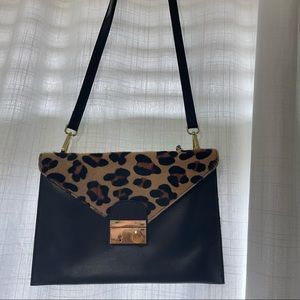 Victoria Napoli shoulder bag. Real leather. Cow hide cheetah print flap.
